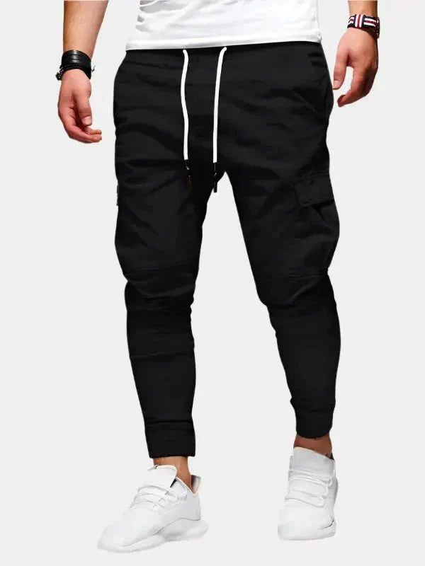 https://cdn.shopify.com/s/files/1/0713/1050/8289/files/casual-jogger-trousers-cross-crown-266043.webp?v=1748047815